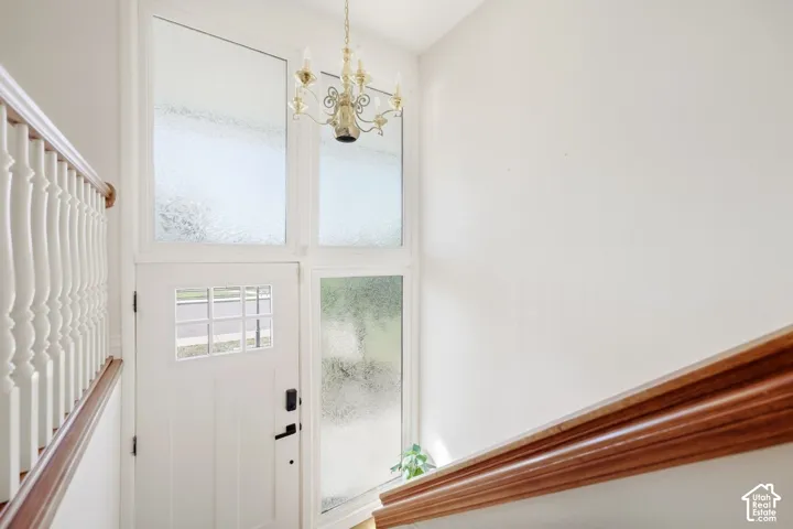 White entryway door with grid window