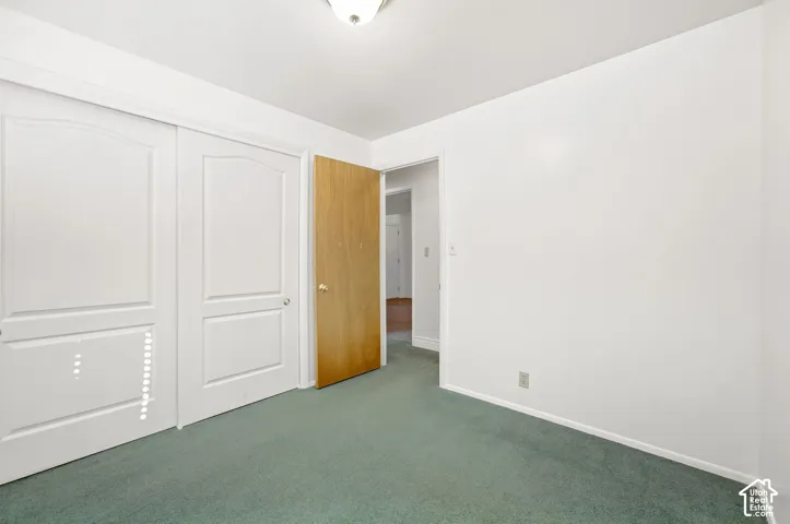 White walls and a flush-mount ceiling light illuminate the space