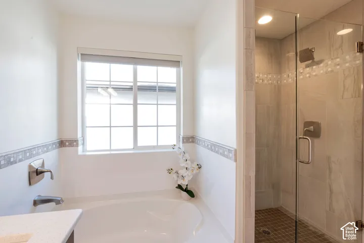 Built-in bathtub with brushed nickel fixtures