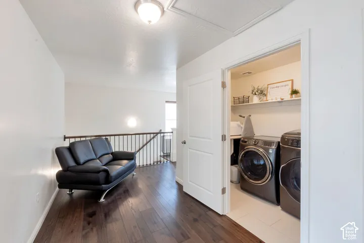 Dark wood-finish flooring with a white wall finish