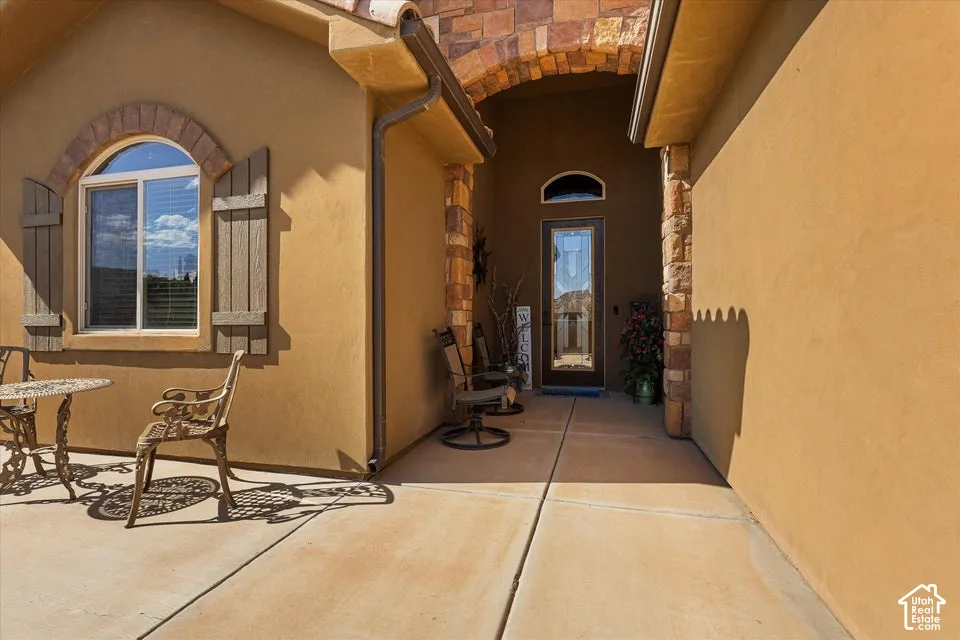 Arched transom window with wood shutters