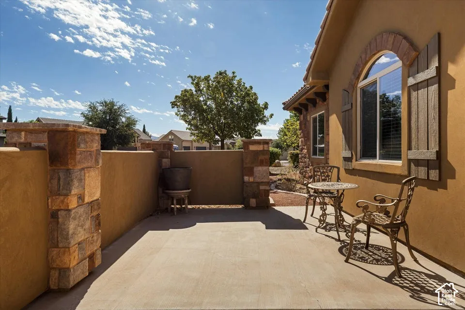 Private patio with concrete flooring