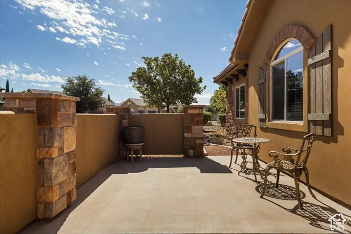 Private patio with concrete flooring