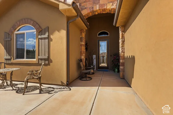 Arched transom window with wood shutters