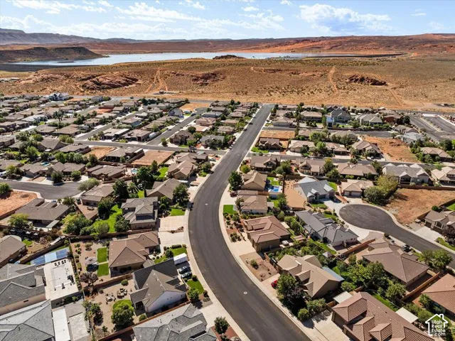Residential neighborhood featuring varied rooflines, mature landscaping, and paved streets