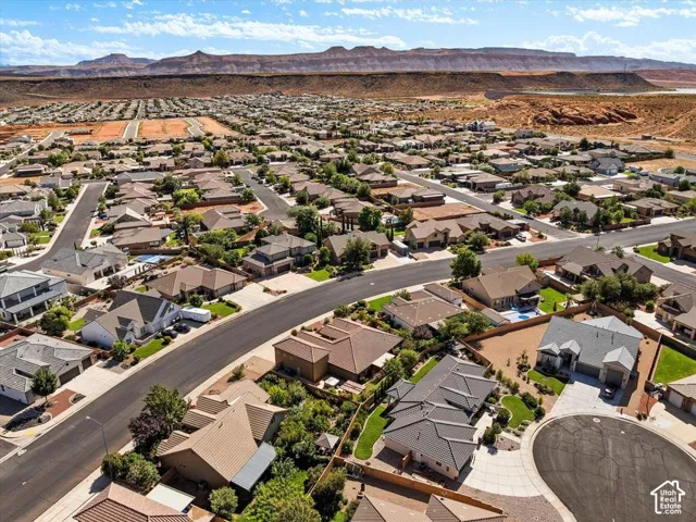 Residential neighborhood with varied rooflines and a desert landscape backdrop