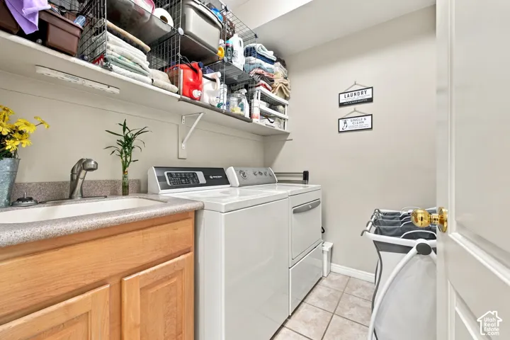 Main-level laundry room with sink.