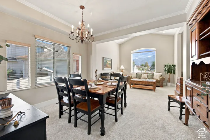 Open concept living space with arched entryway, vaulted ceiling, and recessed lighting