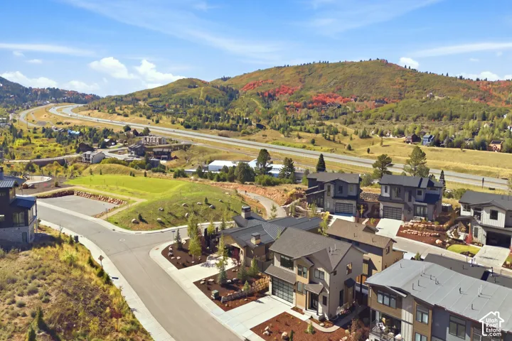 Modern residences with multi-level architecture, integrated garages, and well-maintained landscaping