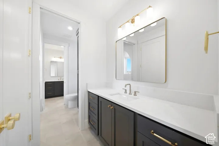 White countertop with integrated sink and brushed nickel faucet