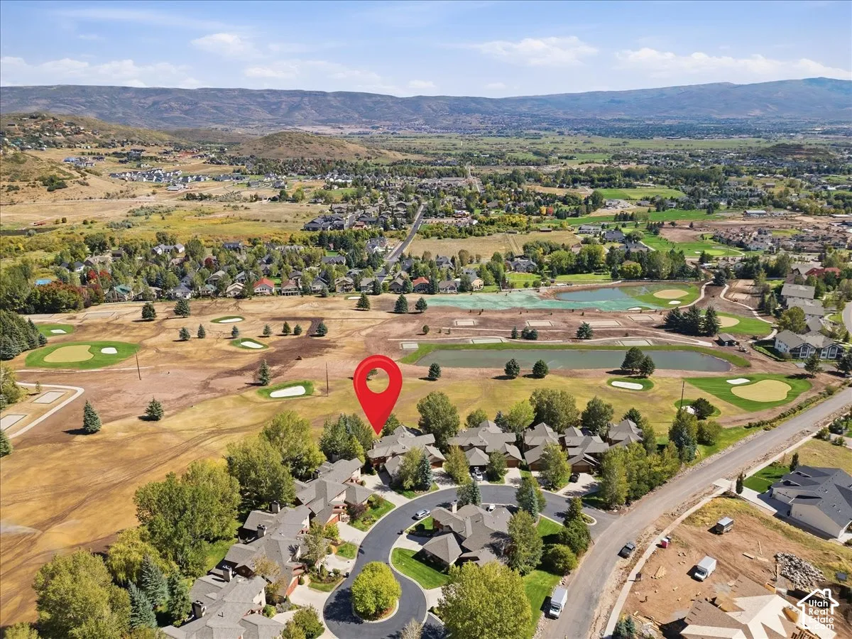 Aerial perspective showcasing the golf course community, and the surrounding valley
