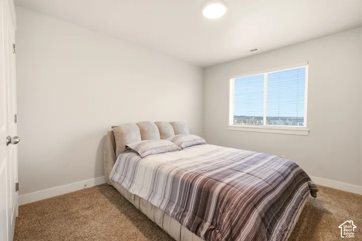 Carpeted flooring, white trim, recessed lighting, and a window with blinds