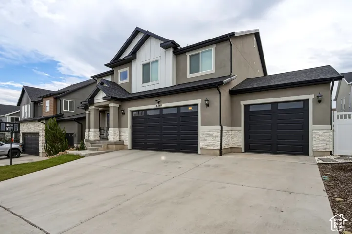 Multi-car garage with contemporary black doors