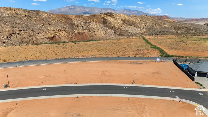 Expansive, level building lot with paved road frontage and utility access