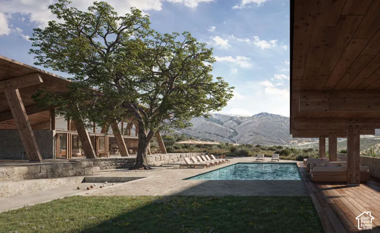 Expansive outdoor space featuring a swimming pool, wood-finish decking, and a bocce ball court