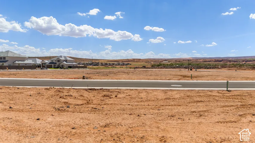 Paved road frontage with surrounding desert landscape