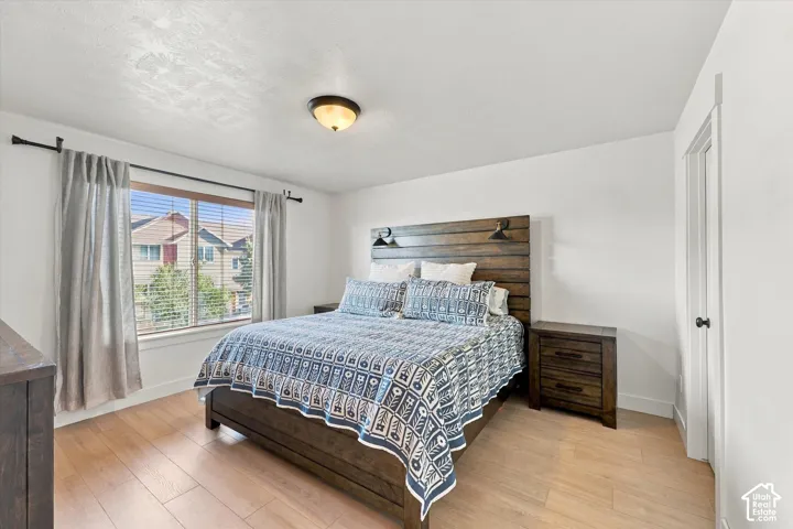 Wood-finish flooring with white walls and trim
