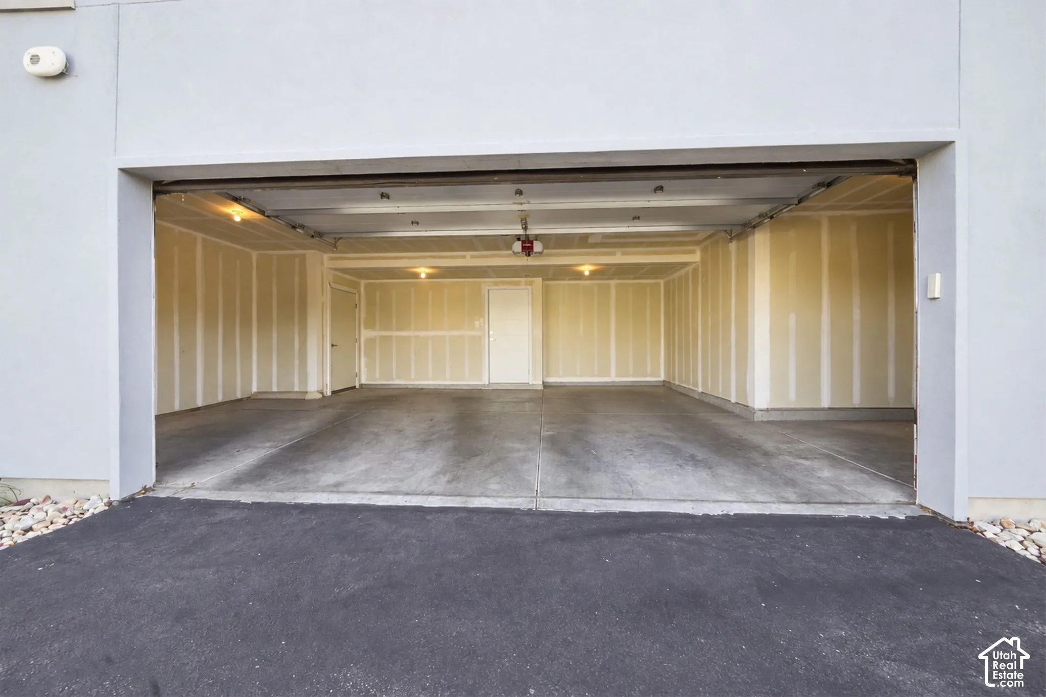 Digitally altered to remove cars and packing boxes.