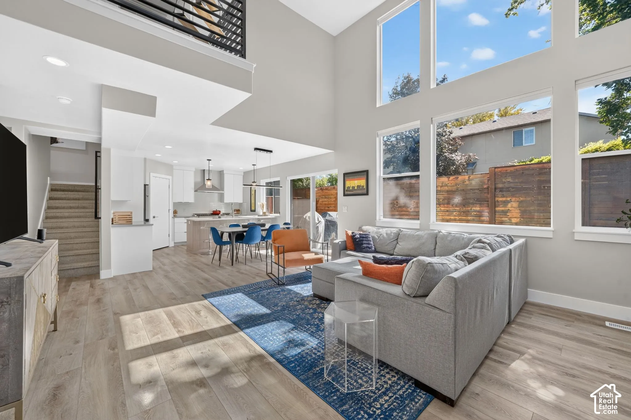 View of light-filled open concept living, dining and kitchen area