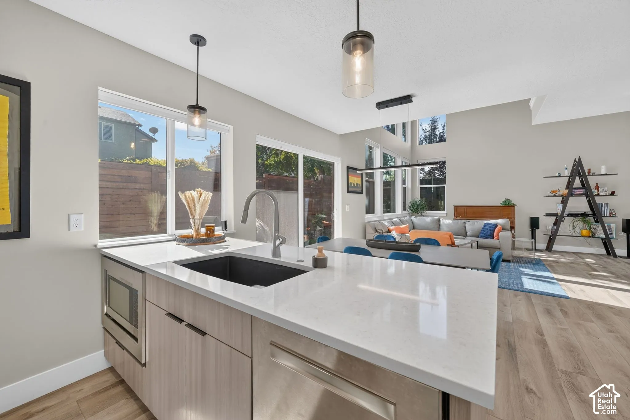 Kitchen island with a built-in sink and stainless steel appliances