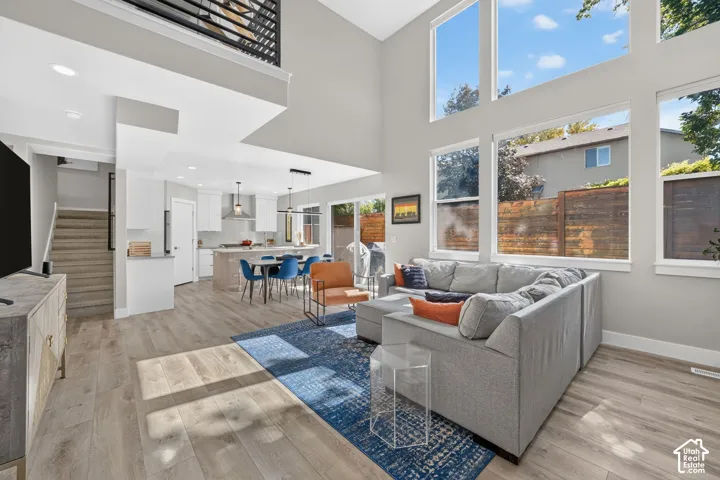 View of light-filled open concept living, dining and kitchen area