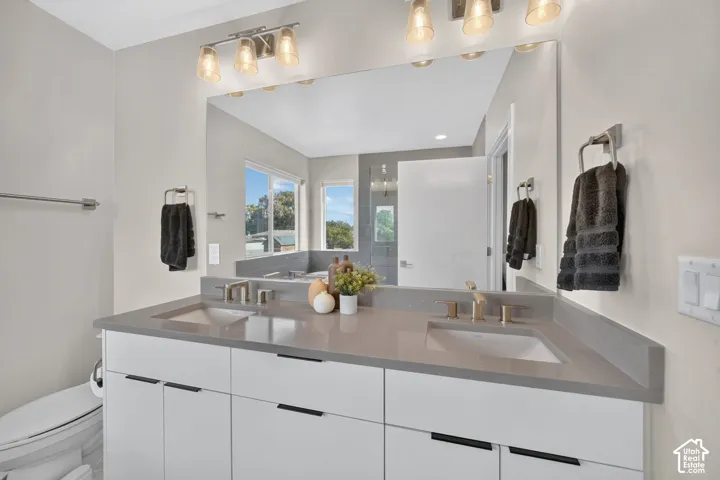 Dual vanity with integrated sinks, and under-cabinet storage