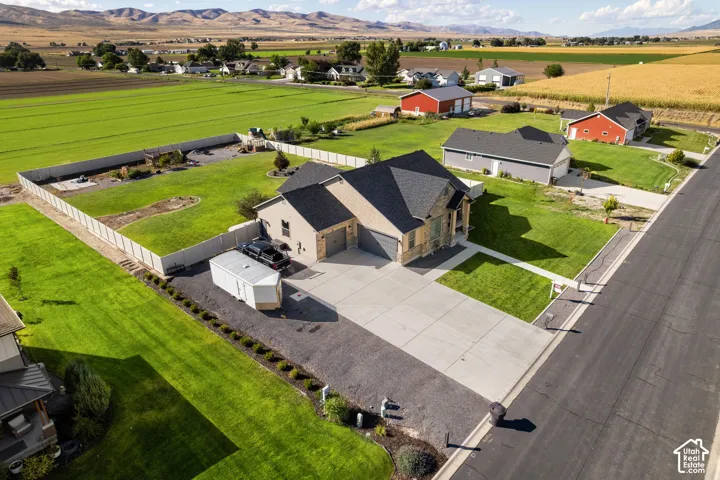 Expansive paved driveway and attached garage