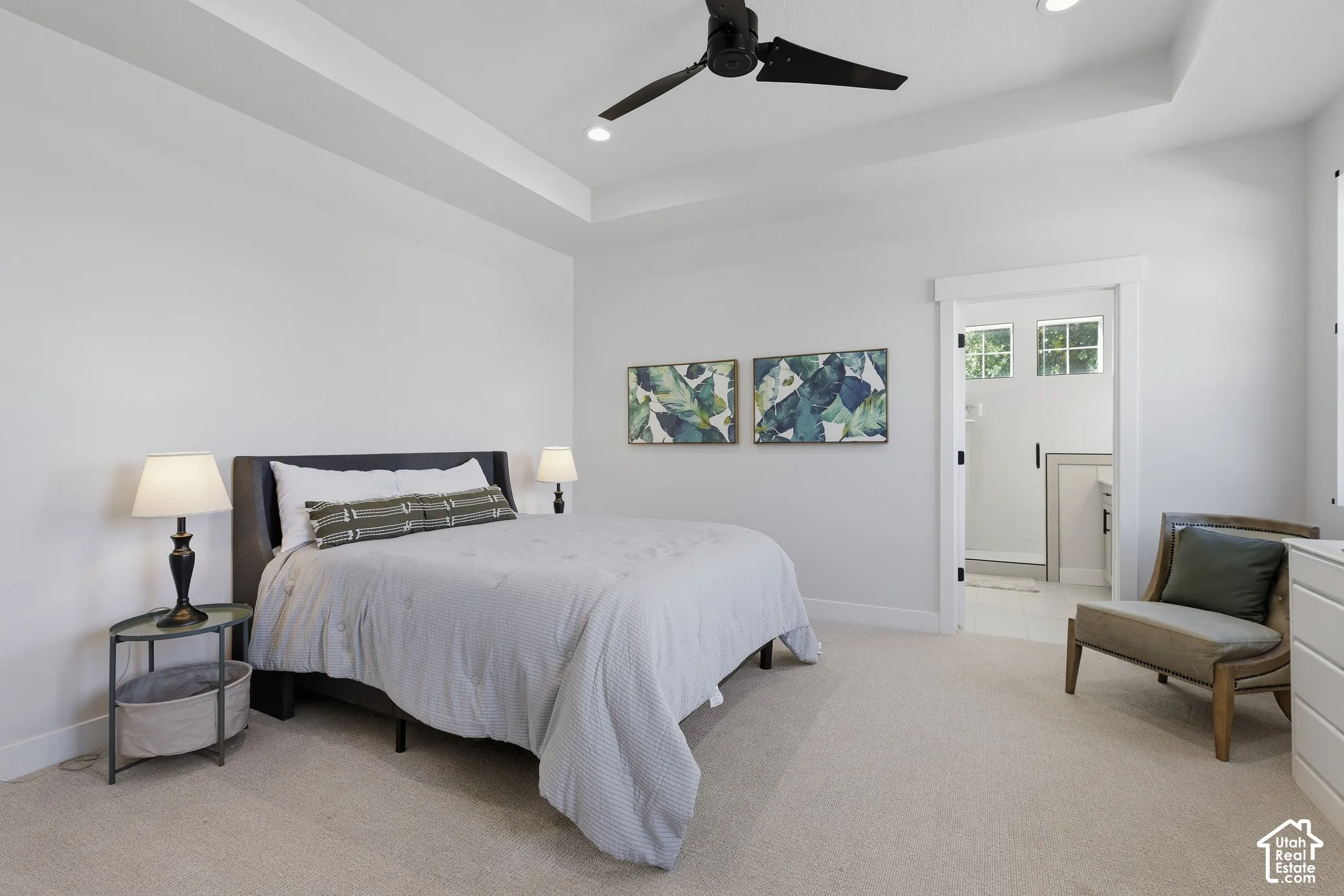 Main level primary suite  with walk in closet and a spa style