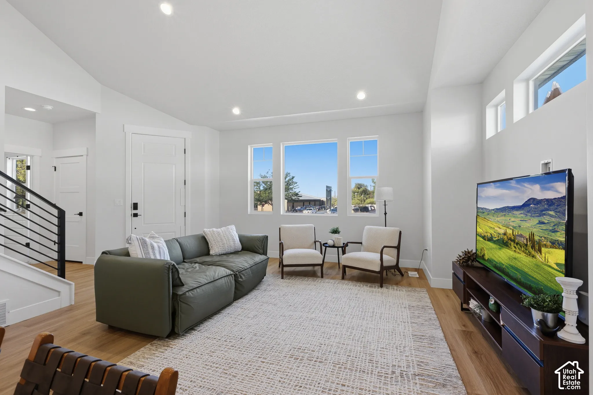 Open great room with tons of natural light, lvp flooring and plenty of room for entertaining