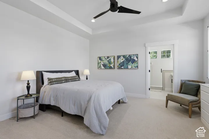 Main level primary suite  with walk in closet and a spa style
