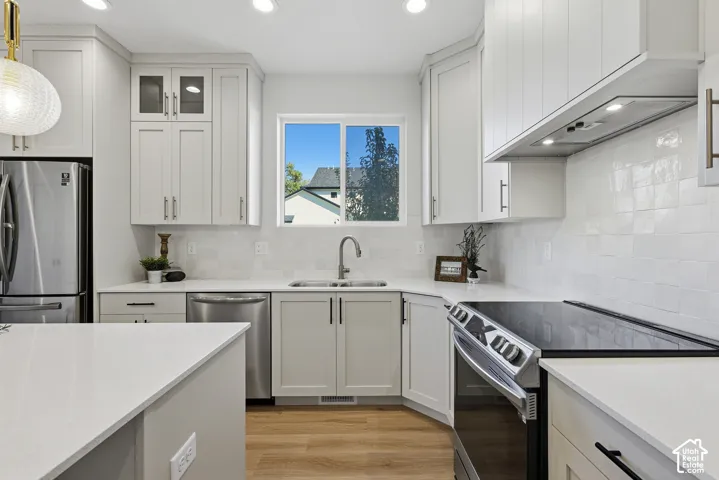 Gourmet kitchen with quartz countertops, stainless steel appliances, center island and large pantry