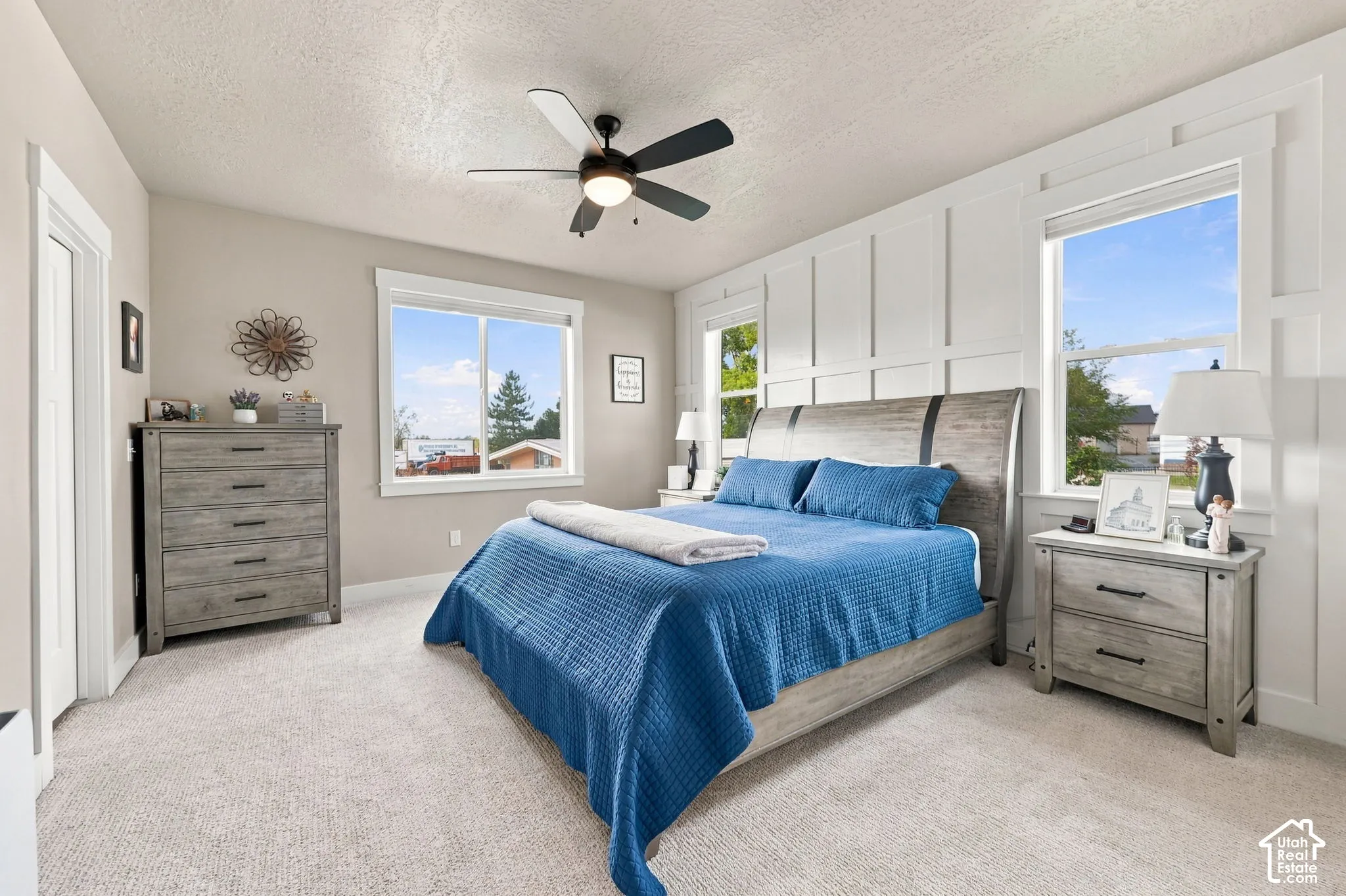 Neutral-toned wall paint, white trim, and light-colored carpet flooring