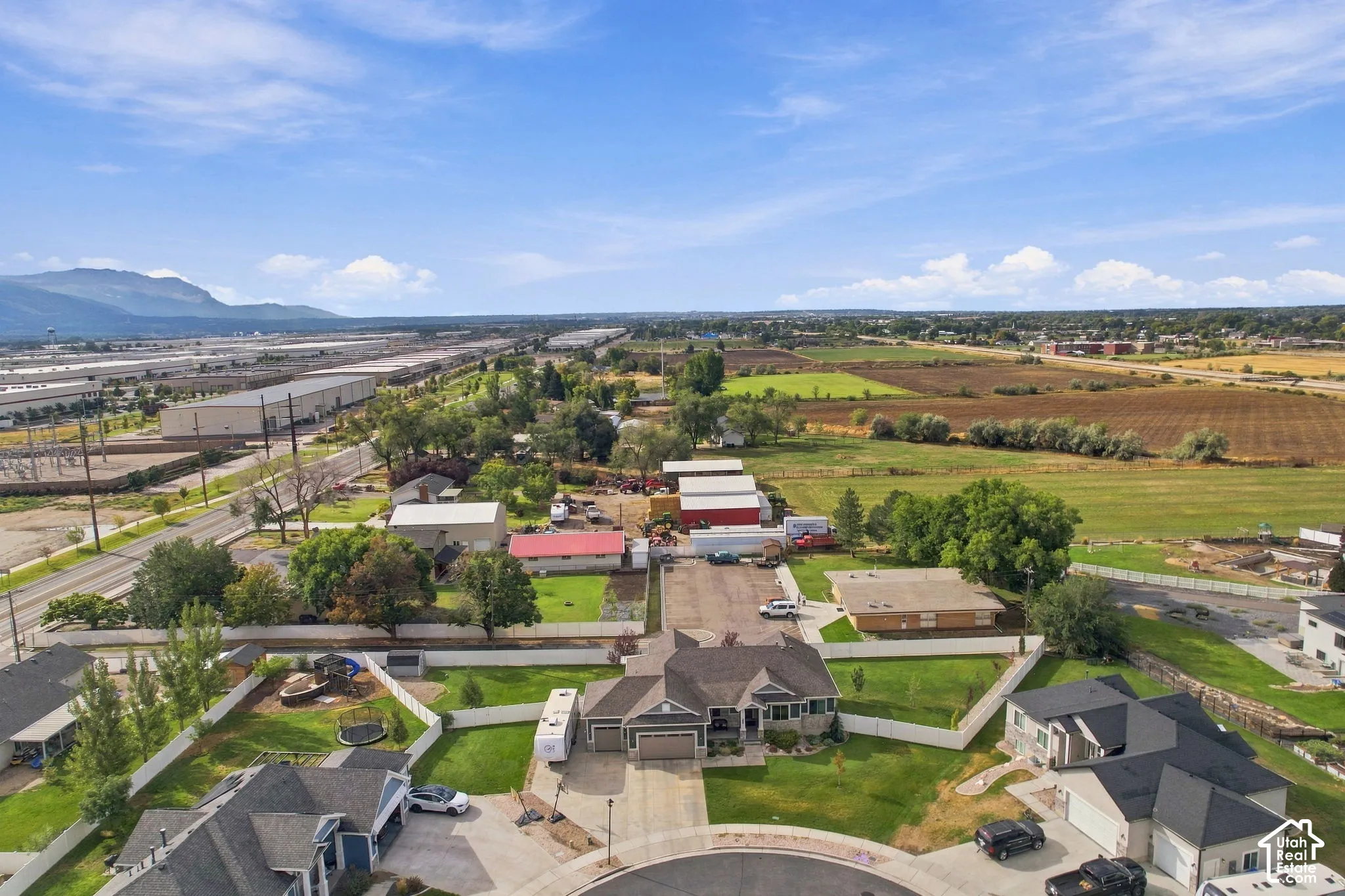 Cul-de-sac location with a white fenced yard and landscaped front