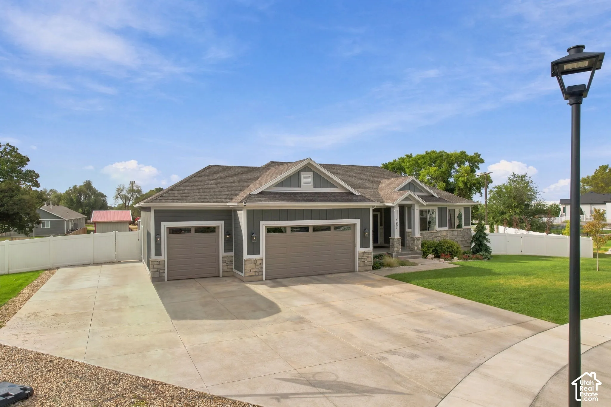 Ranch-style exterior with stone veneer accents and horizontal siding