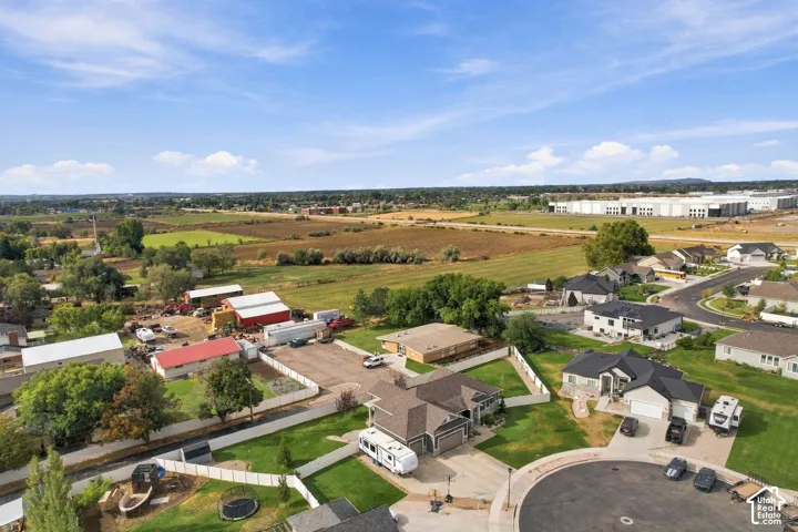 Residential properties with paved streets and surrounding agricultural land