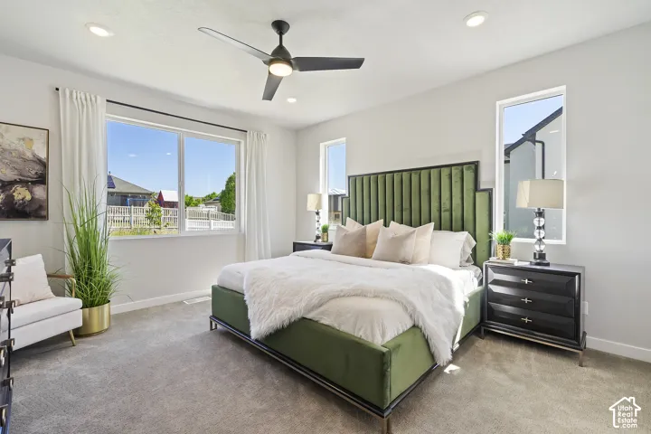 Spacious room featuring carpet flooring, recessed lighting, and a ceiling fan