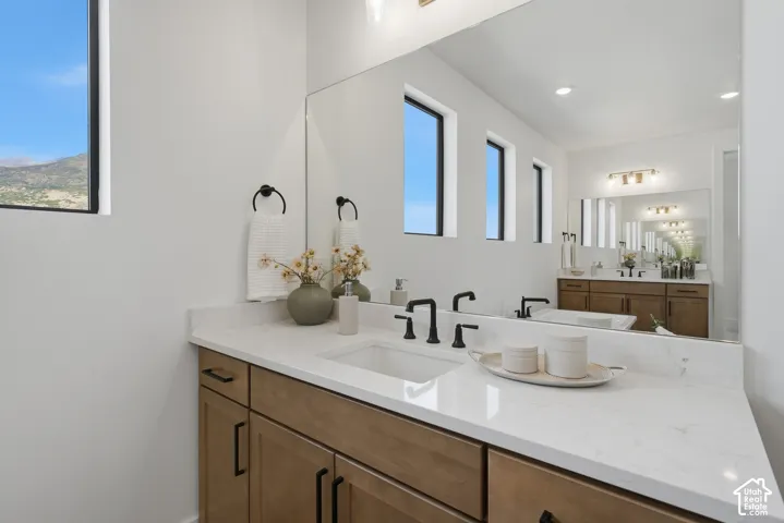 White countertop with integrated sink and matte black faucet