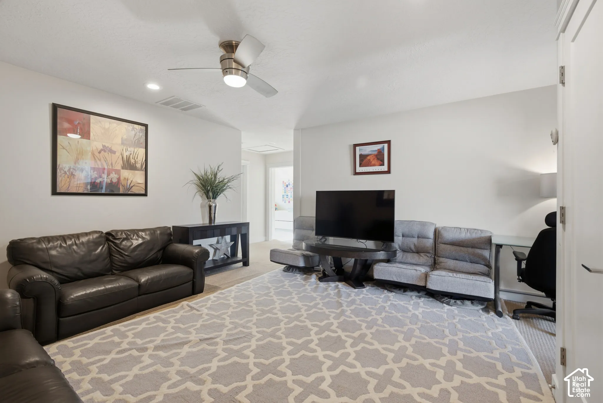 Recessed lighting, sloped ceiling, and a ceiling fan with integrated lighting