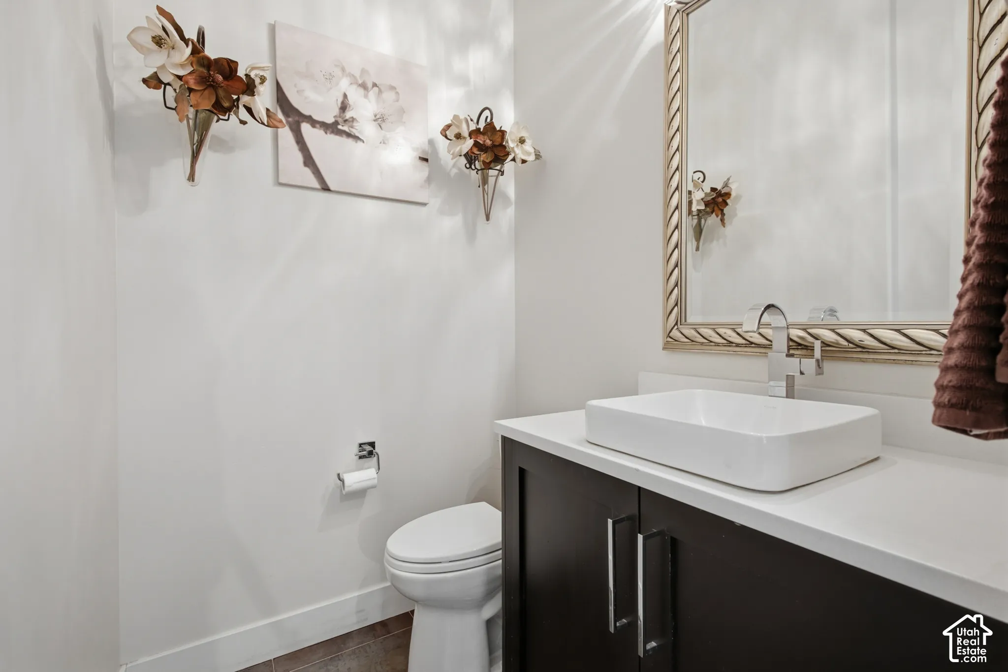 Dark wood-finish vanity with silver hardware