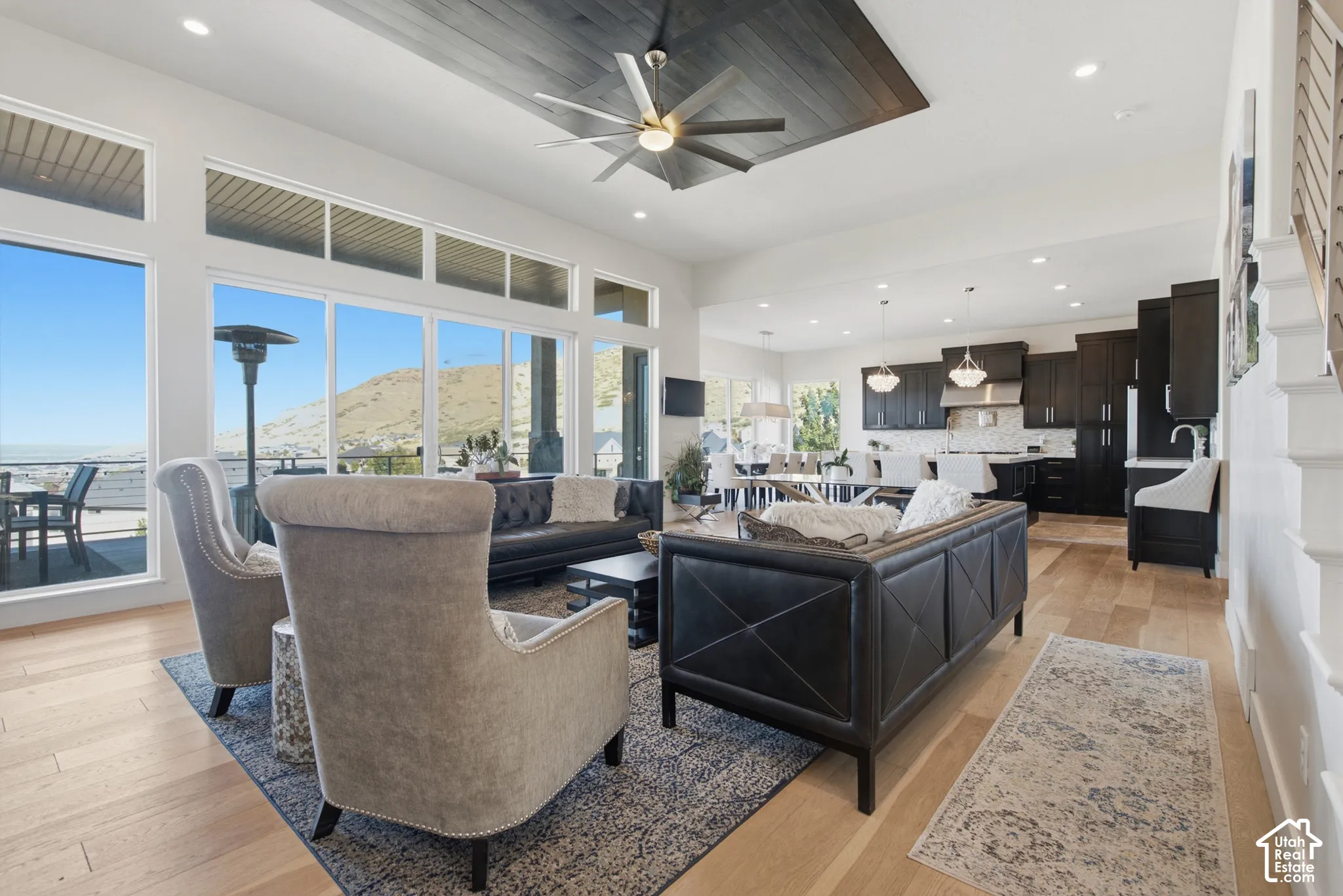 Open-concept living space with light wood-finish flooring