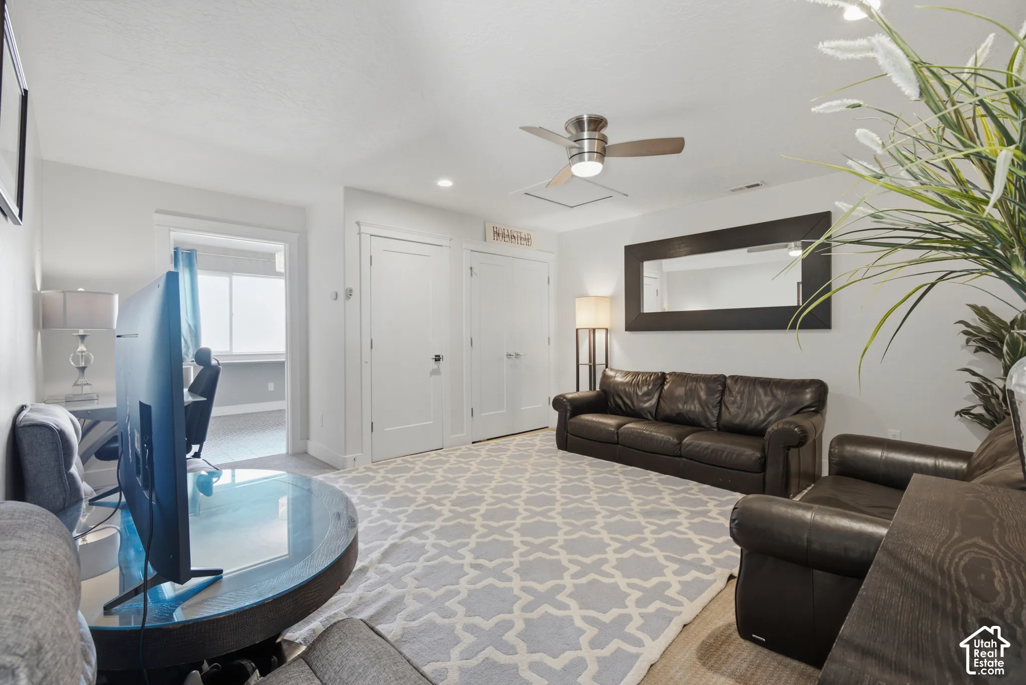 Recessed ceiling lighting, ceiling fan with integrated lighting, and white interior doors
