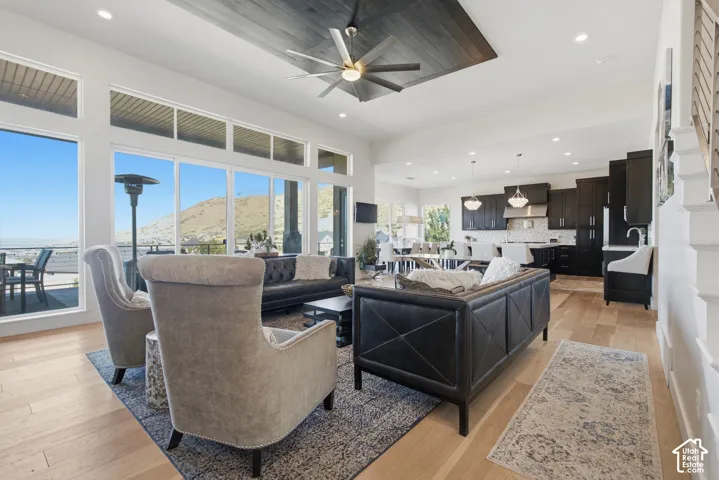 Open-concept living space with light wood-finish flooring