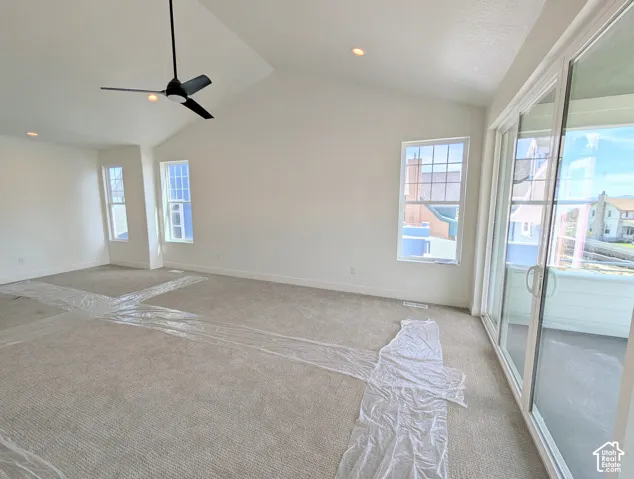 Primary bedroom with Vaulted ceiling featuring a contemporary ceiling fan and recessed lighting