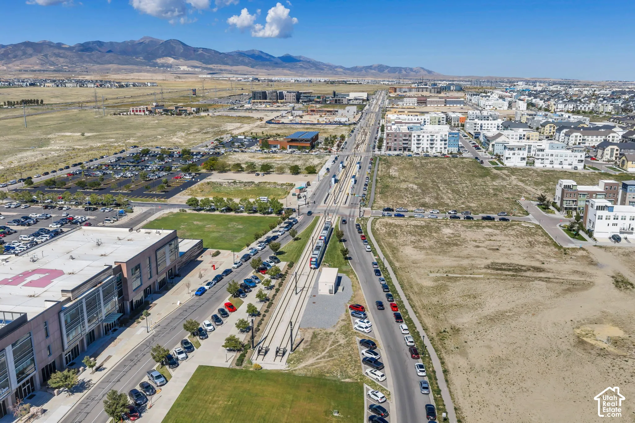 Expansive undeveloped land parcels with mountain backdrop