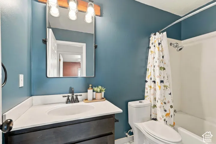 Modern vanity with an integrated sink and dark-finished cabinetry