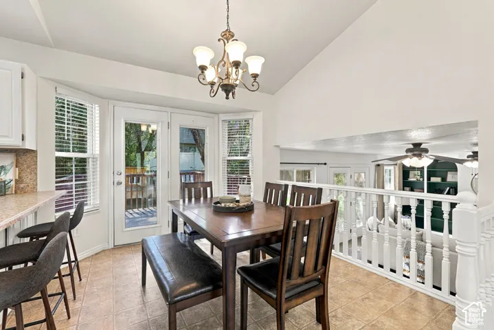 Breakfast nook with bay windows, French doors, and tile flooring