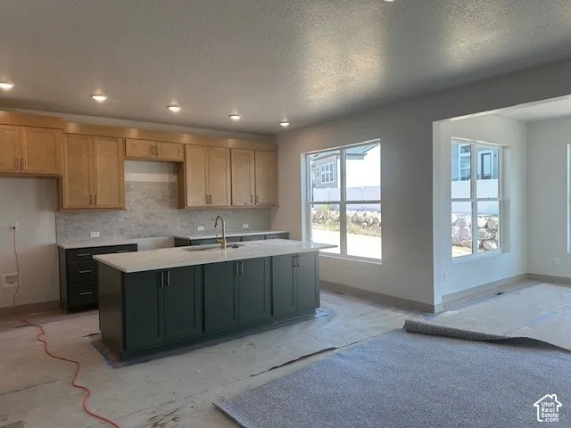Bright open kitchen with island and sunroom