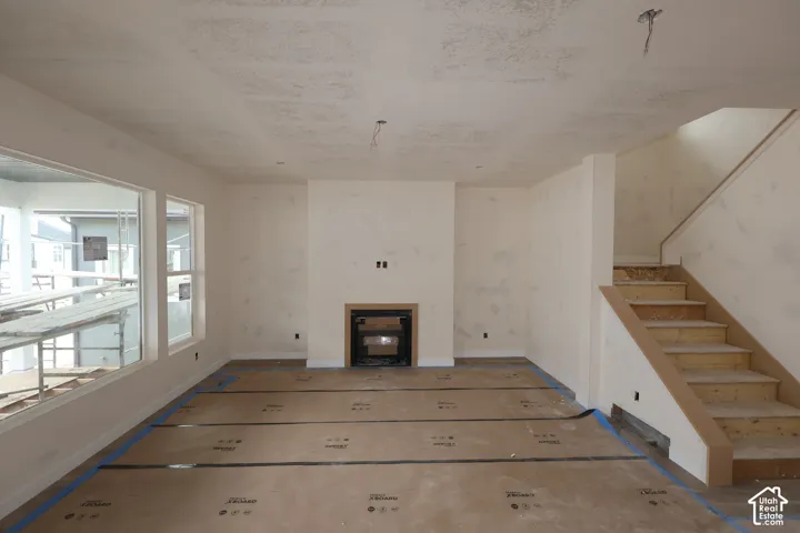 Living Room with Gas fireplace with view of large covered deck