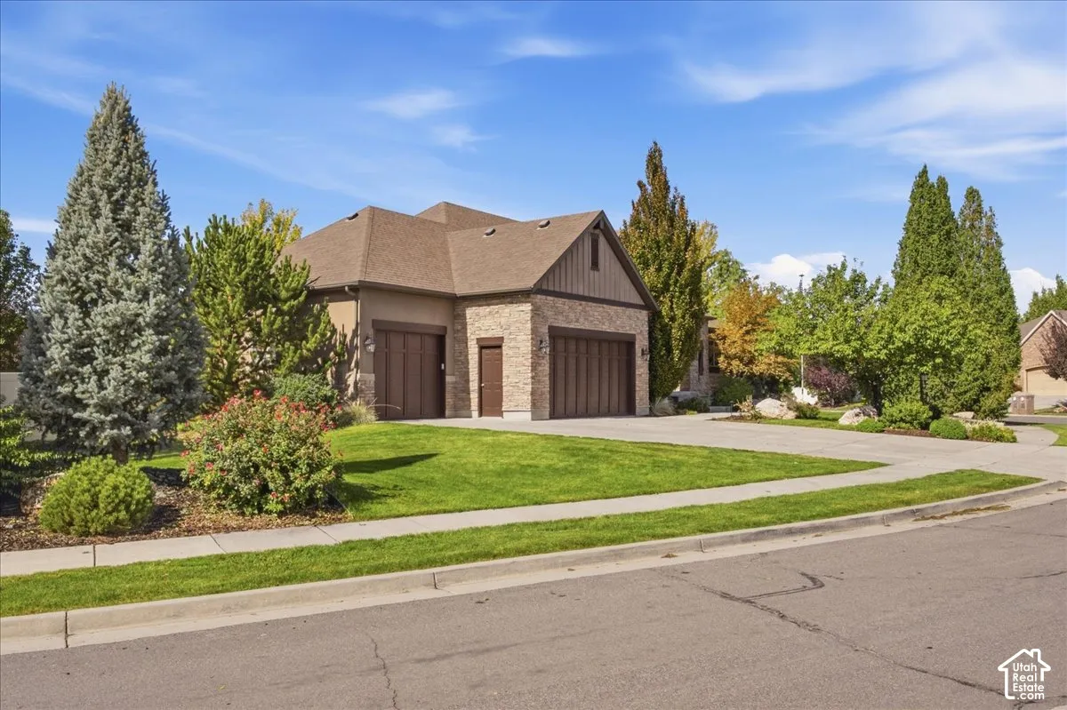 Stucco and brick facade with a multi-car garage