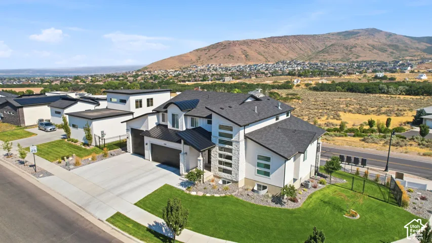 Modern exterior with white siding and dark trim